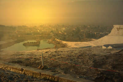 High angle view of buildings against sky during sunset