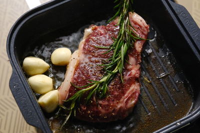 High angle view of meat in cooking pan