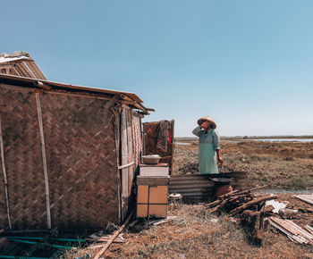 Female on field against clear sky