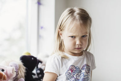 Portrait of angry little girl at classroom