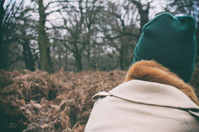 Rear view of woman in forest