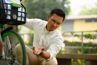 Side view of man using mobile phone