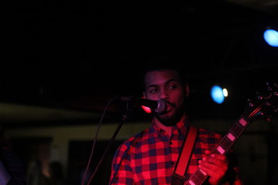 Young man performing at nightclub