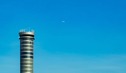 Commercial airline flying on blue sky and white fluffy clouds. under view of airplane flying. 