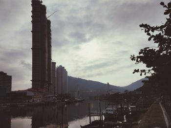 City buildings against cloudy sky