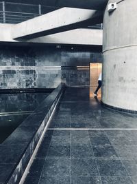 Side view of man walking in building