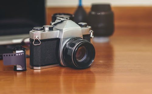 Close-up of camera on table