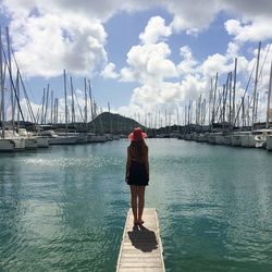 Rear view of a woman standing in water