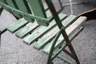Close-up of empty wooden chair on floor