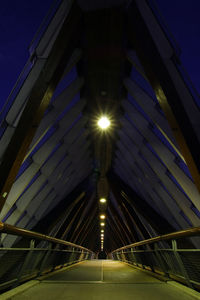 Low angle view of illuminated street light at night
