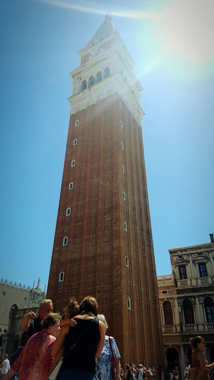 architecture, building exterior, large group of people, built structure, real people, sky, outdoors, crowd, day