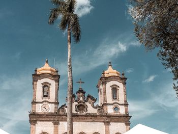 Low angle view of church and building against sky