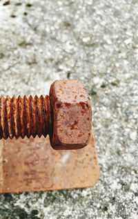 Close-up of rusty metal on rock