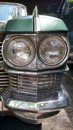 Close-up of car on road