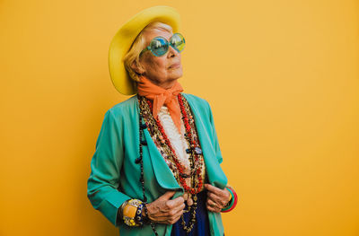 Smiling woman against pink background