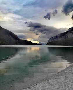 Scenic view of lake against sky during sunset