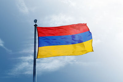 Low angle view of flag against sky