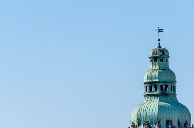 Tower of building against clear blue sky