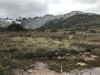 Scenic view of landscape and mountains against sky