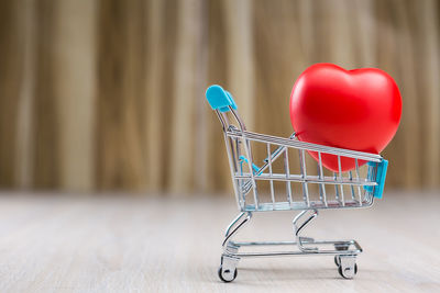 Close-up of heart shape in cart on table