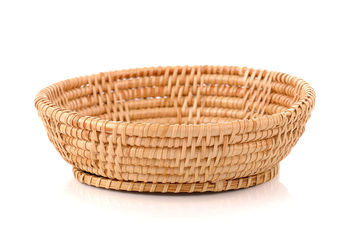 Close-up of wicker basket against white background