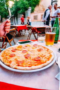 Close-up of pizza on table in restaurant