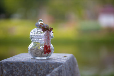 Close-up of glass jar on table