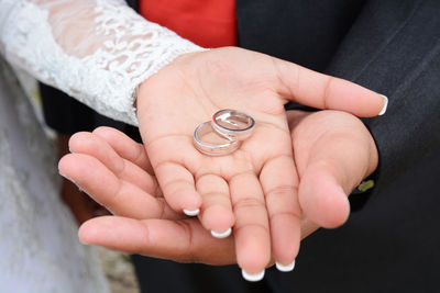 Cropped image of woman holding hands