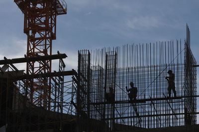 Low angle view of men on construction site