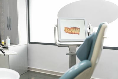 Scanned image of teeth on monitor screen at modern dental clinic