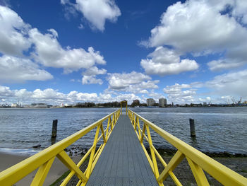 Bridge over sea against sky