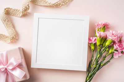 High angle view of pink flower on table