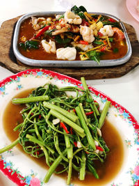 High angle view of chopped vegetables in bowl on table