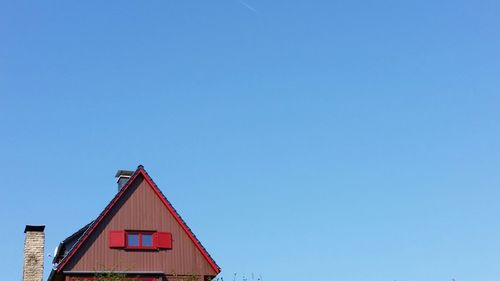 Low angle view of built structure against clear blue sky