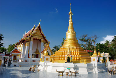 Low angle view of pagoda against clear blue sky