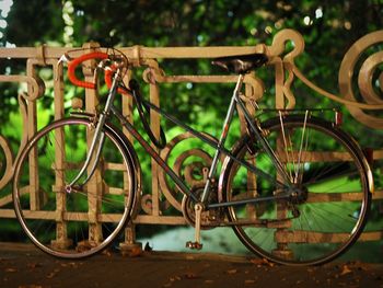 Close-up of bicycle parked against blurred background