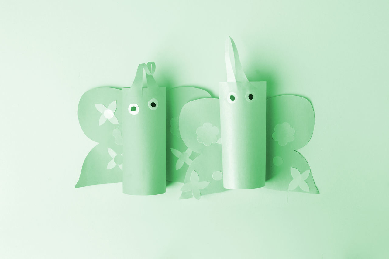 CLOSE-UP OF TOYS OVER GREEN BACKGROUND