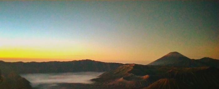 Scenic view of landscape against sky during sunset