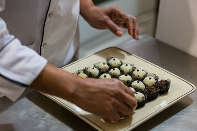 Midsection of man on table