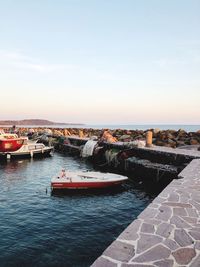 Boats moored in sea