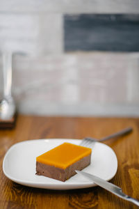 Close-up of cake slice in plate on table