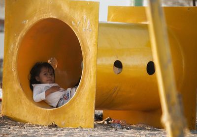 Portrait of cute girl relaxing in playground