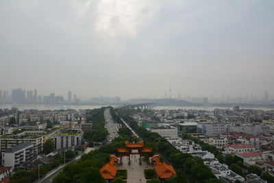 High angle view of buildings in city against sky