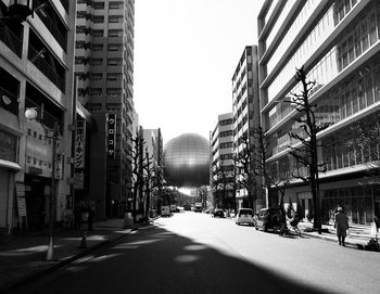 City street amidst buildings against sky