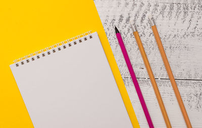 High angle view of pencil and book on table