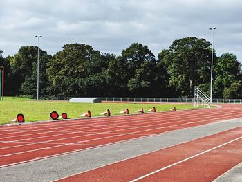 Orange cones laid side on at athletics tracks