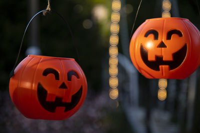 Close-up of illuminated pumpkin lanterns hanging