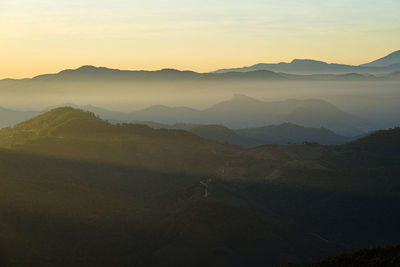 Scenic view of mountains against sky during sunset