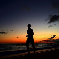 Scenic view of sea at sunset