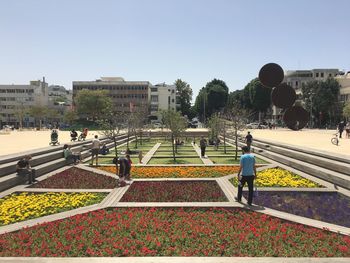Men in city against clear sky